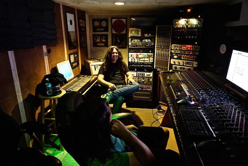Mike and the Beetus sitting in the studio control room.